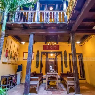 Interior courtyard and wooden gallery inside the heritage house at 87 Ma May