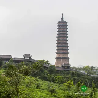 The tall Bao Thap relic tower rising above the Bai Dinh grounds