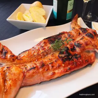 Whole butterflied rabbit grilled until golden brown