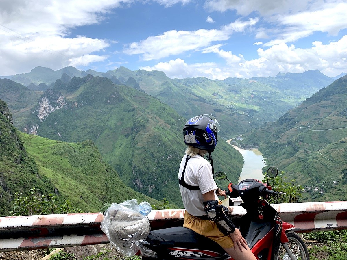 Motorcyclist looking over the mountains in Ha Giang
