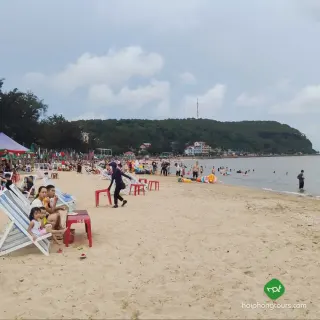 Beachgoers and deckchairs along Do Son Zone 2 beach